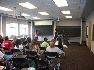 Participants learn about Life Cycle Analysis, the idea that when measuring costs, you should worry about everything "from cradle to grave". L-R: Brinda Thomas, Kim Mullins