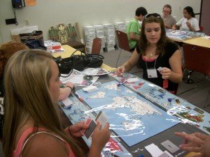 Participants play the climate game at the Museum of Natural History. L-R (Foreground): Brianna Barbarino, Hannah Murray, Melissa Gess, (Background) Ben Stern, Brianna Hill, Kristina Pacifico
