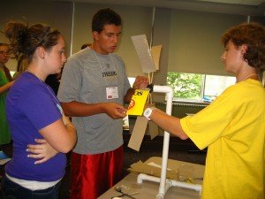 Participants measure output from solar cells. L-R: Chelsea Geruschat, Melissa Gess