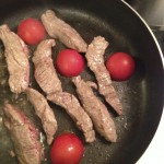 Add the tomatoes just before the steak is done